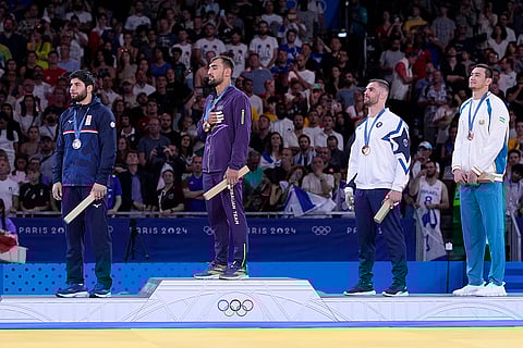 Medal ceremony for men's -100 kg event in the team judo competition